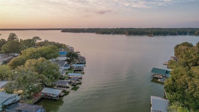 aerial view at dusk with a water view