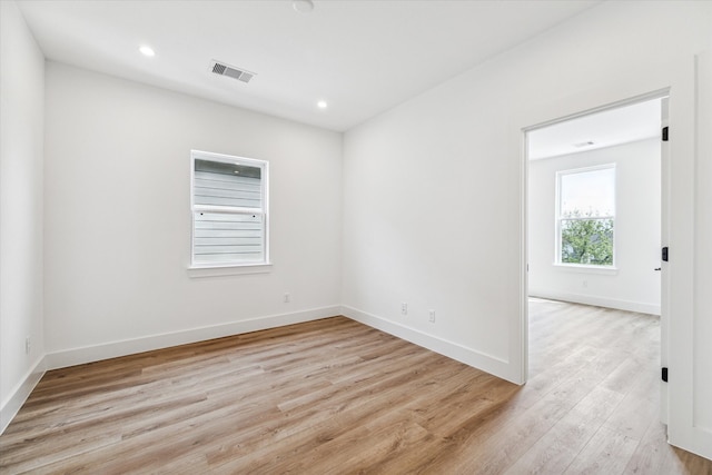 spare room with light wood-type flooring