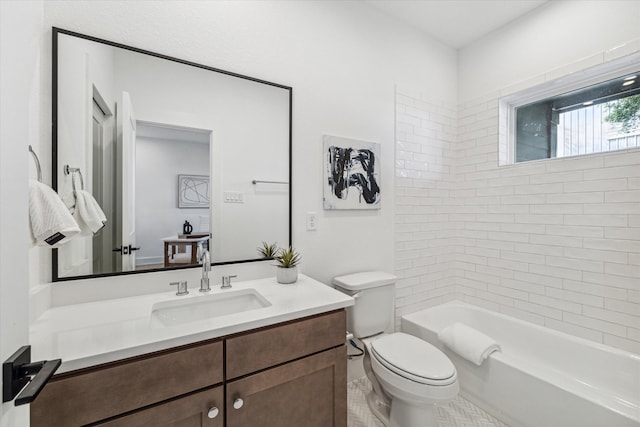 full bathroom with vanity, toilet, and tiled shower / bath combo