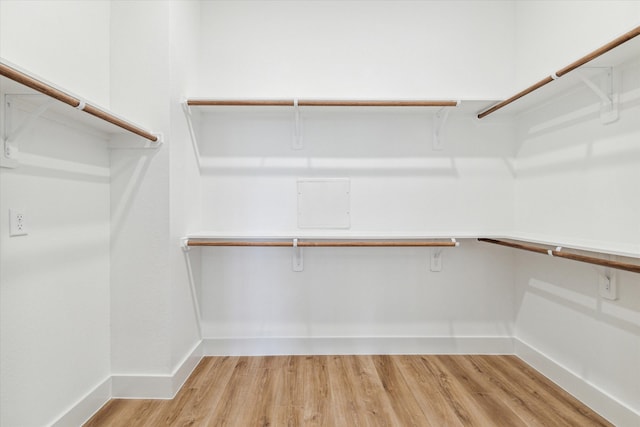 walk in closet featuring light hardwood / wood-style floors