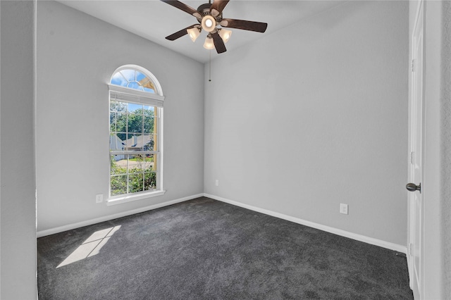 carpeted empty room featuring ceiling fan