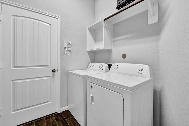 laundry room featuring dark wood-type flooring and washing machine and clothes dryer