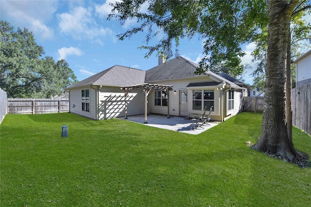 back of property with a pergola, a yard, and a patio area