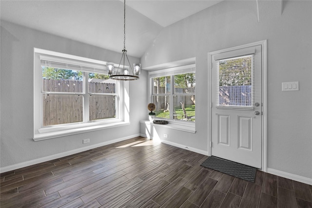 interior space with an inviting chandelier and vaulted ceiling