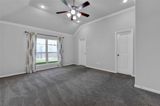 unfurnished room with dark colored carpet, ornamental molding, and vaulted ceiling