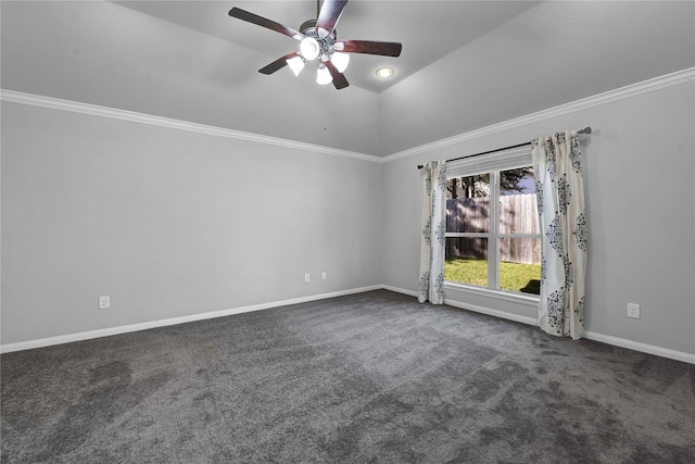 carpeted spare room featuring lofted ceiling, ornamental molding, and ceiling fan