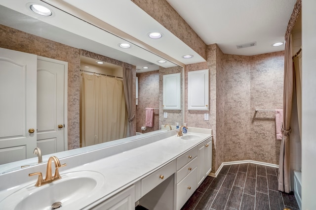 bathroom featuring wood-type flooring, vanity, and a shower with curtain