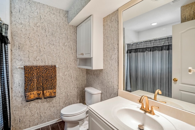 bathroom featuring walk in shower, wood-type flooring, vanity, and toilet