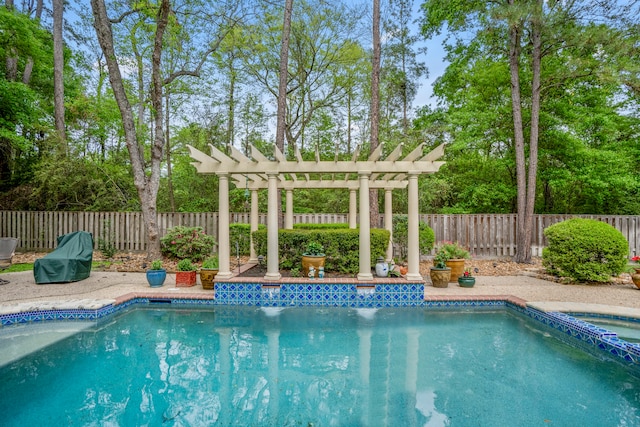 view of pool with a hot tub and a pergola