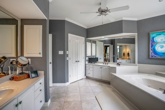 bathroom with tile patterned floors, crown molding, vanity, a washtub, and ceiling fan