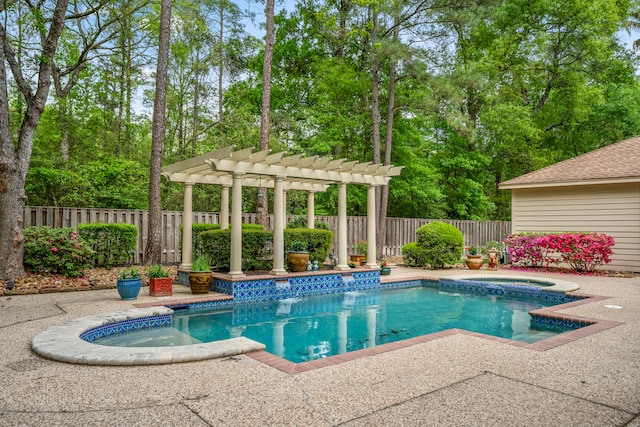 view of pool featuring a pergola, an in ground hot tub, and a patio area