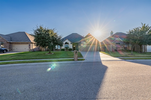 view of front of house with a garage and a front yard