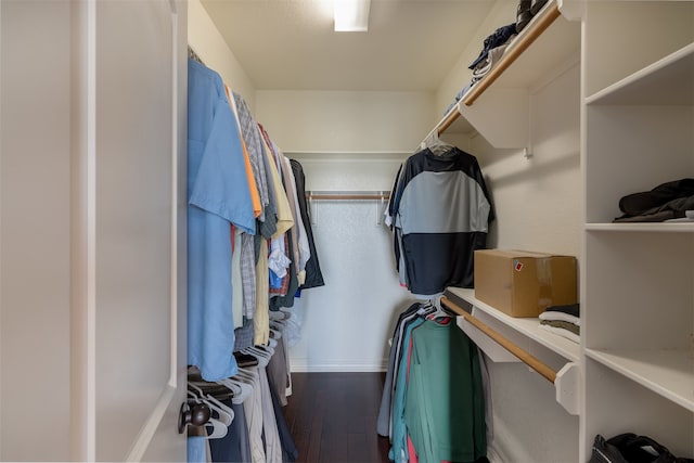 walk in closet featuring dark hardwood / wood-style flooring