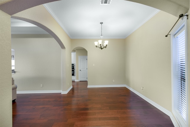 unfurnished room with ornamental molding, dark hardwood / wood-style flooring, and an inviting chandelier