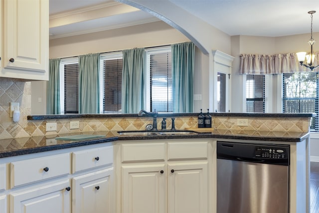 kitchen with dishwasher, plenty of natural light, decorative backsplash, and white cabinets