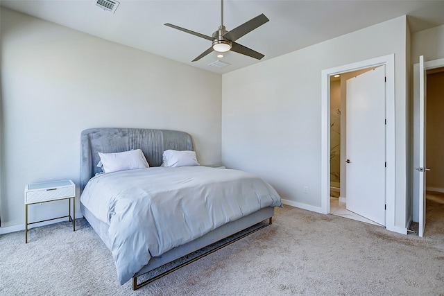 bedroom with ceiling fan and light colored carpet