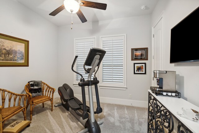 workout area with light carpet and ceiling fan