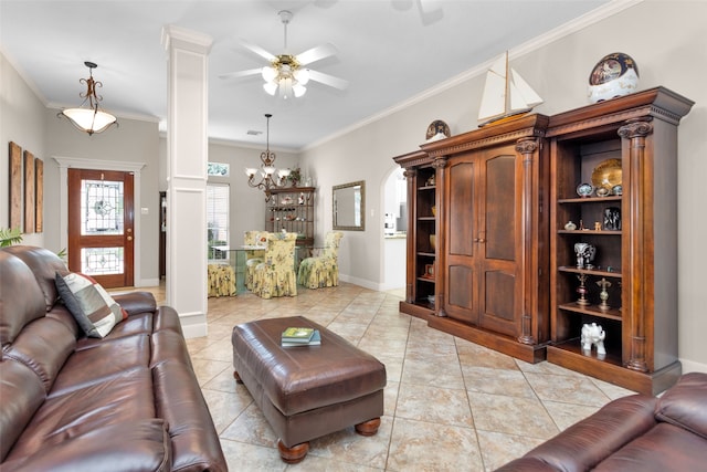 tiled living room featuring ornate columns, crown molding, and ceiling fan with notable chandelier