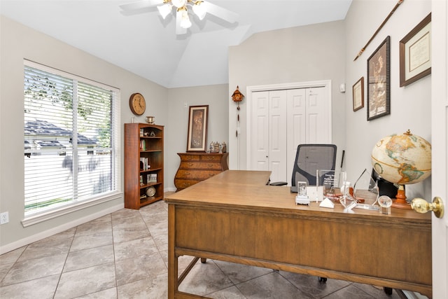 office area with ceiling fan, light tile patterned flooring, and vaulted ceiling