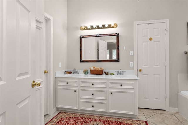 bathroom with tile patterned floors and vanity