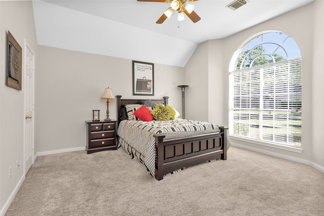 carpeted bedroom with ceiling fan and lofted ceiling