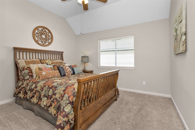 bedroom with ceiling fan, light carpet, and vaulted ceiling