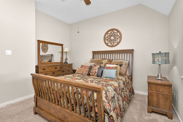 carpeted bedroom with vaulted ceiling and ceiling fan