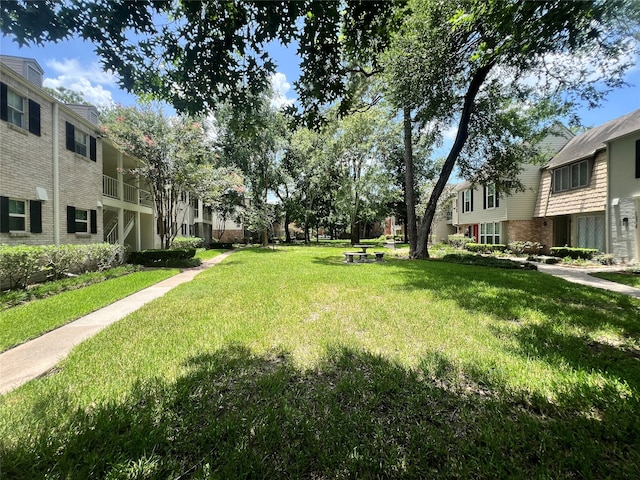 surrounding community featuring a lawn