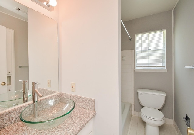 full bathroom featuring tile patterned flooring, vanity, toilet, and bathing tub / shower combination