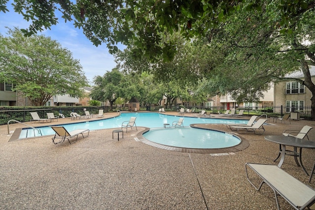 view of pool featuring a patio area