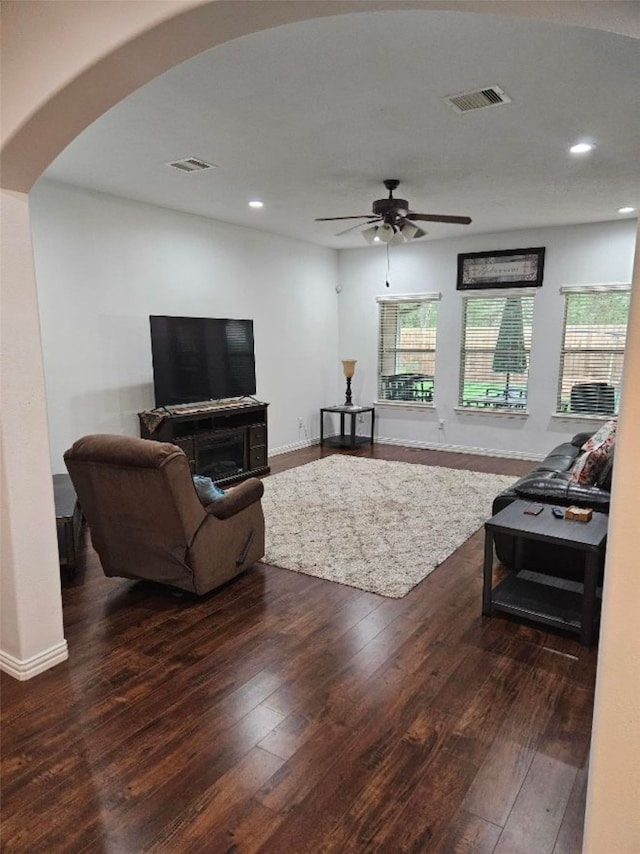 10438 Lauren Creek Dr, Baytown, TX 77523 - living area with arched walkways, wood-type flooring, recessed lighting, a ceiling fan, and baseboards