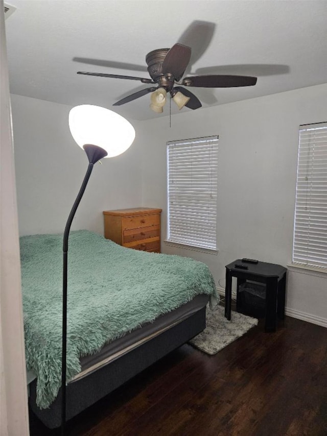 10438 Lauren Creek Dr, Baytown, TX 77523 - bedroom featuring wood finished floors, ceiling fan, and baseboards