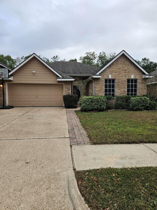 10438 Lauren Creek Dr, Baytown, TX 77523 - ranch-style home featuring an attached garage, driveway, brick siding, and a front lawn