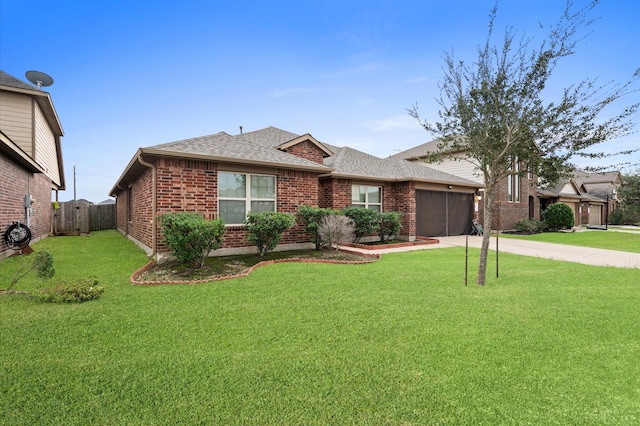 ranch-style home featuring a garage and a front yard