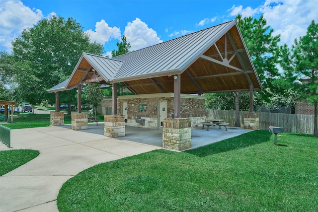 view of home's community featuring a patio, a lawn, and a gazebo