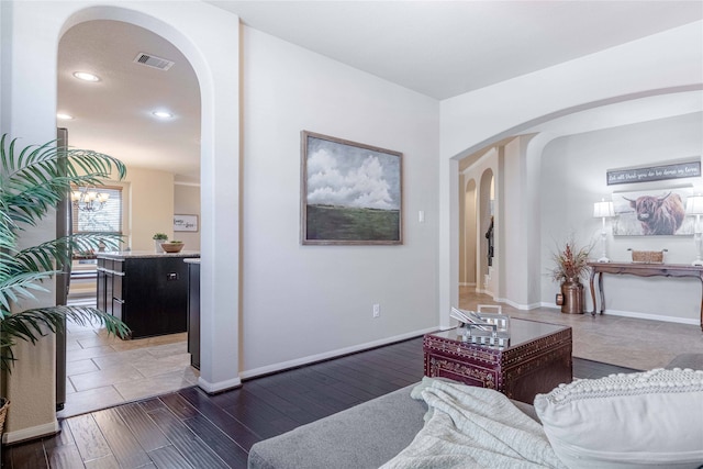 living room with dark hardwood / wood-style flooring