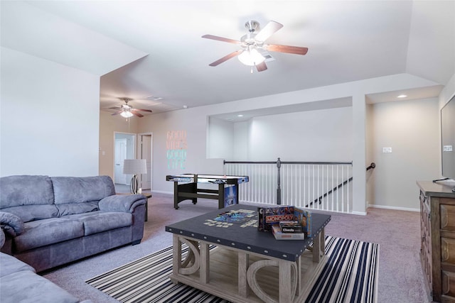 carpeted living room with ceiling fan