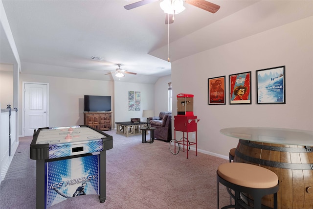 game room with carpet flooring and ceiling fan