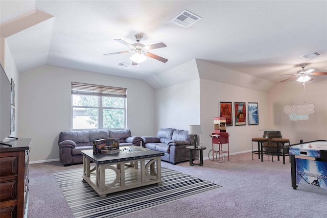 living room with carpet floors, ceiling fan, and vaulted ceiling