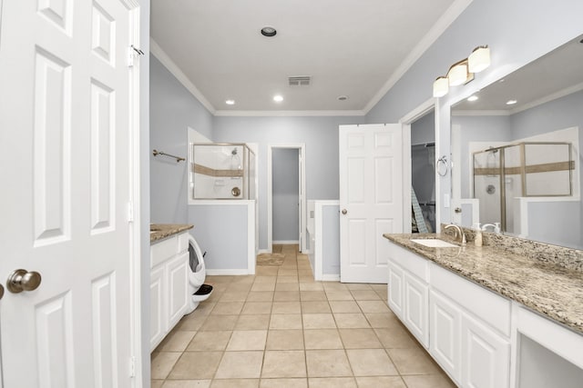 bathroom featuring vanity, ornamental molding, and walk in shower