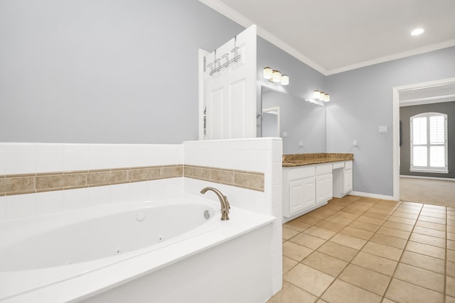 bathroom with tile patterned flooring, vanity, a bathtub, and ornamental molding