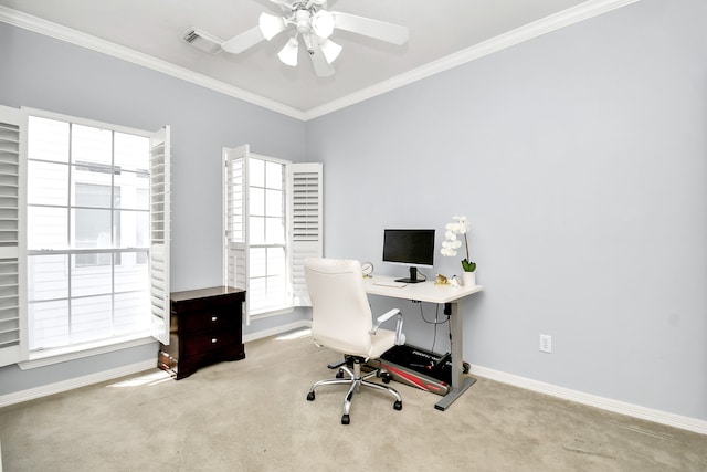 office space featuring light carpet, a wealth of natural light, and ornamental molding