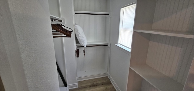 18103 Shaman Dr, Galveston, TX 77554 - walk in closet with wood finished floors