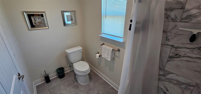 18103 Shaman Dr, Galveston, TX 77554 - bathroom with toilet and a marble finish shower