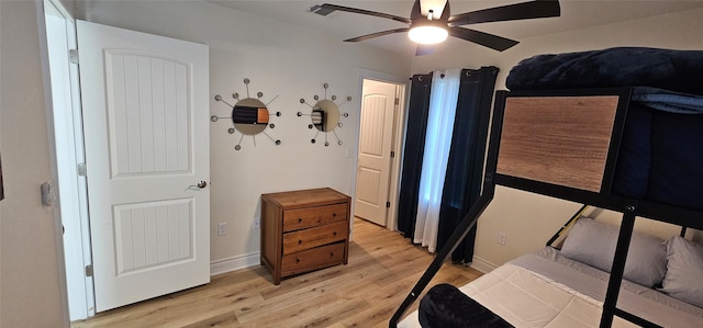 18103 Shaman Dr, Galveston, TX 77554 - bedroom featuring light wood-type flooring, baseboards, and ceiling fan