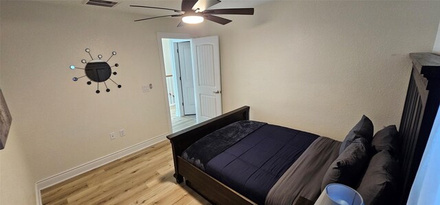 18103 Shaman Dr, Galveston, TX 77554 - bedroom featuring light wood finished floors, baseboards, and a ceiling fan