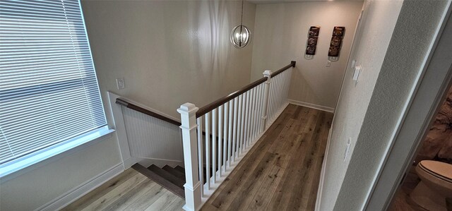 18103 Shaman Dr, Galveston, TX 77554 - stairs featuring wood finished floors