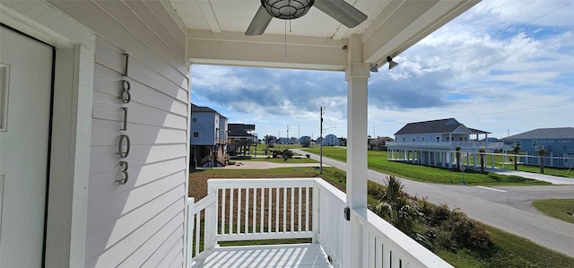18103 Shaman Dr, Galveston, TX 77554 - covered porch with a residential view and ceiling fan