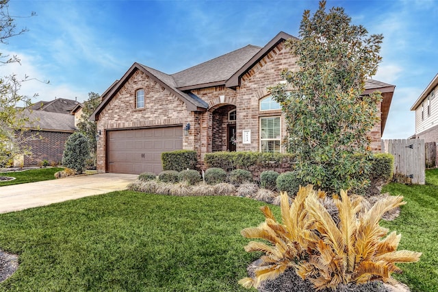 3614 Daintree Park Dr, Katy, TX 77494 - french country style house with brick siding, concrete driveway, a shingled roof, and a garage