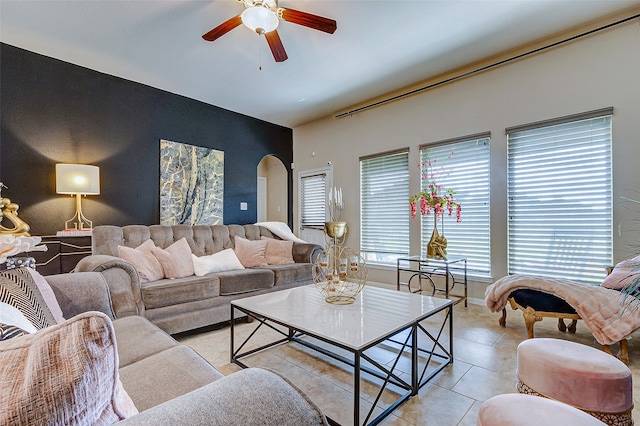 living room featuring ceiling fan and light tile patterned floors